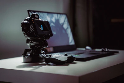 a toy action figure on a laptop