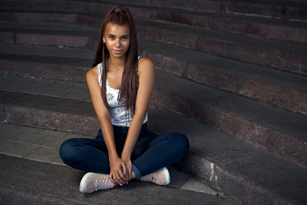 a woman sitting on stairs