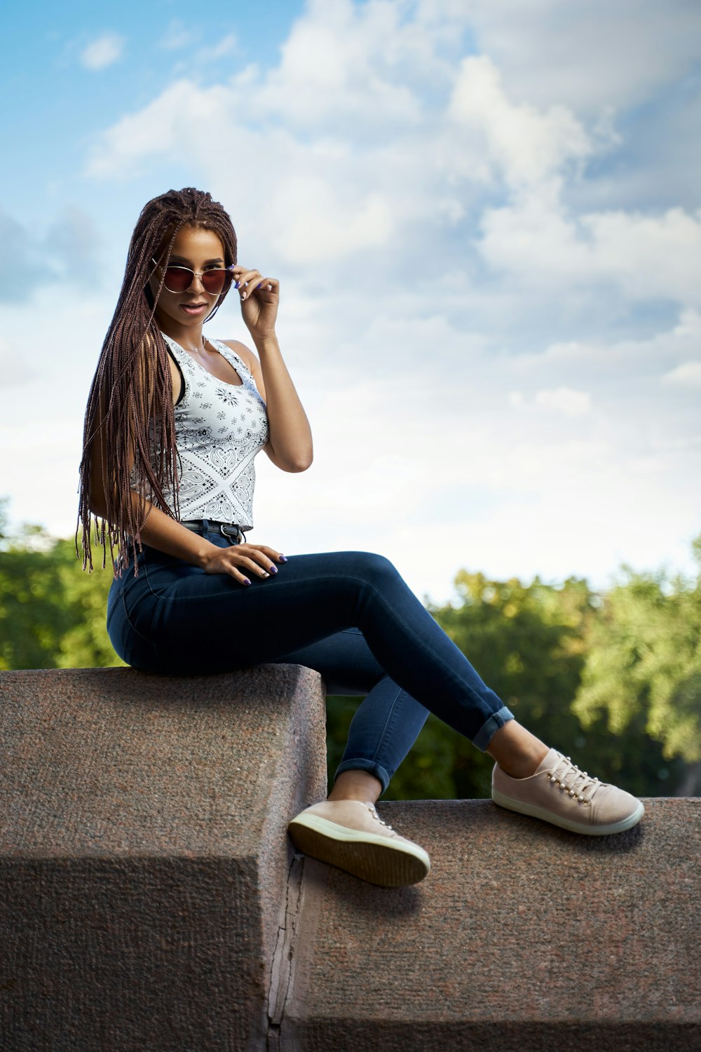 a person sitting on a ledge