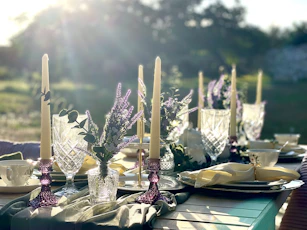 a table with candles and flowers