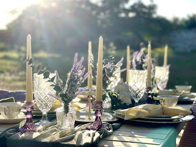 a table with candles and flowers