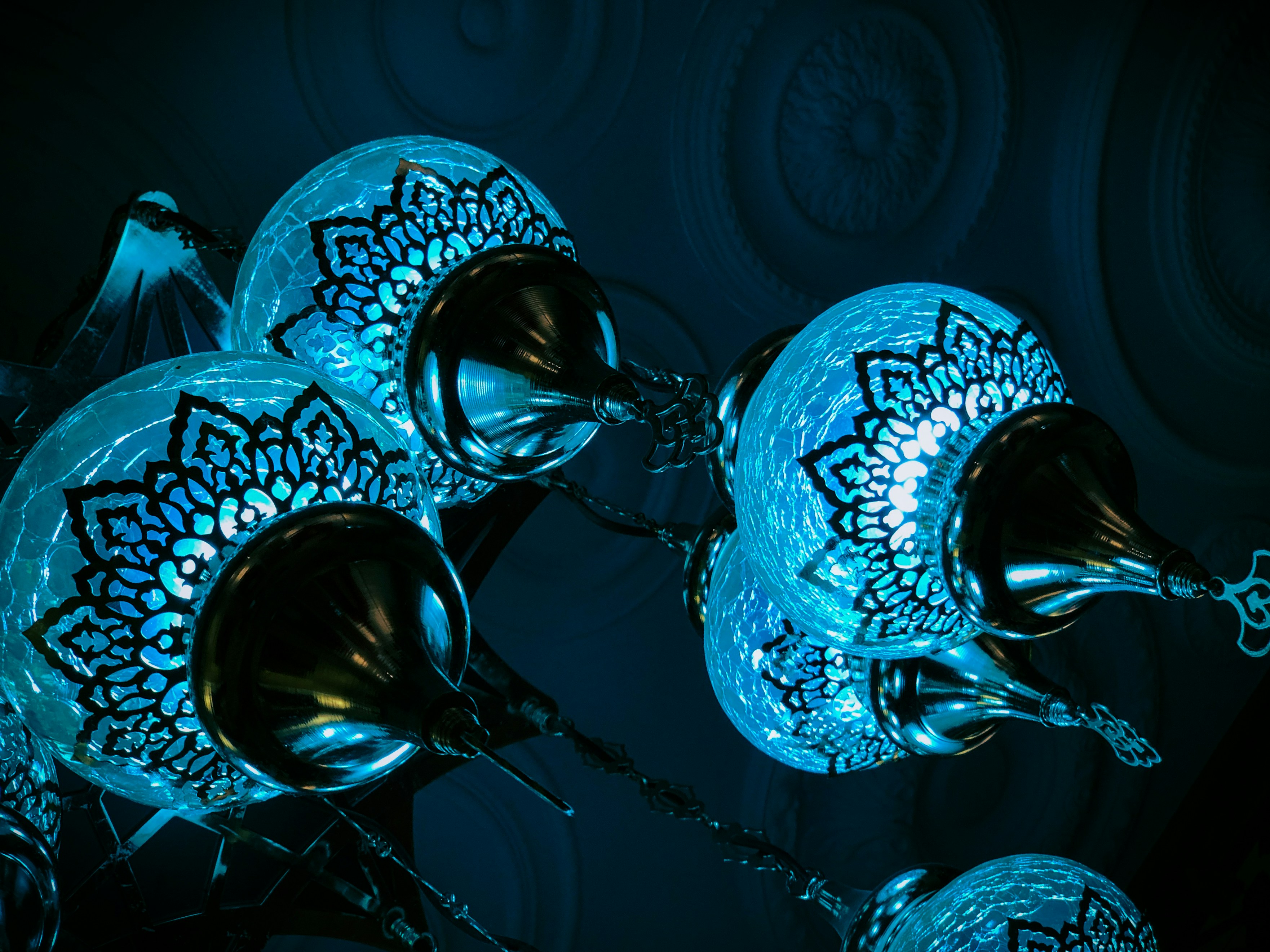 a group of clear and blue glass bowls