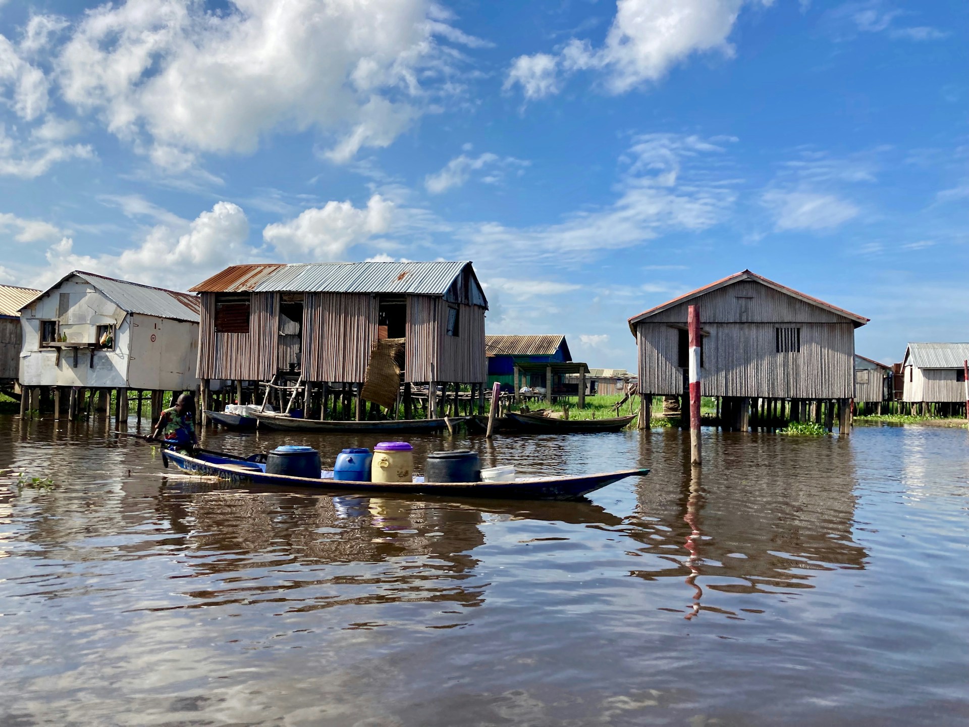 a boat in the water with Tonlé Sap in the background