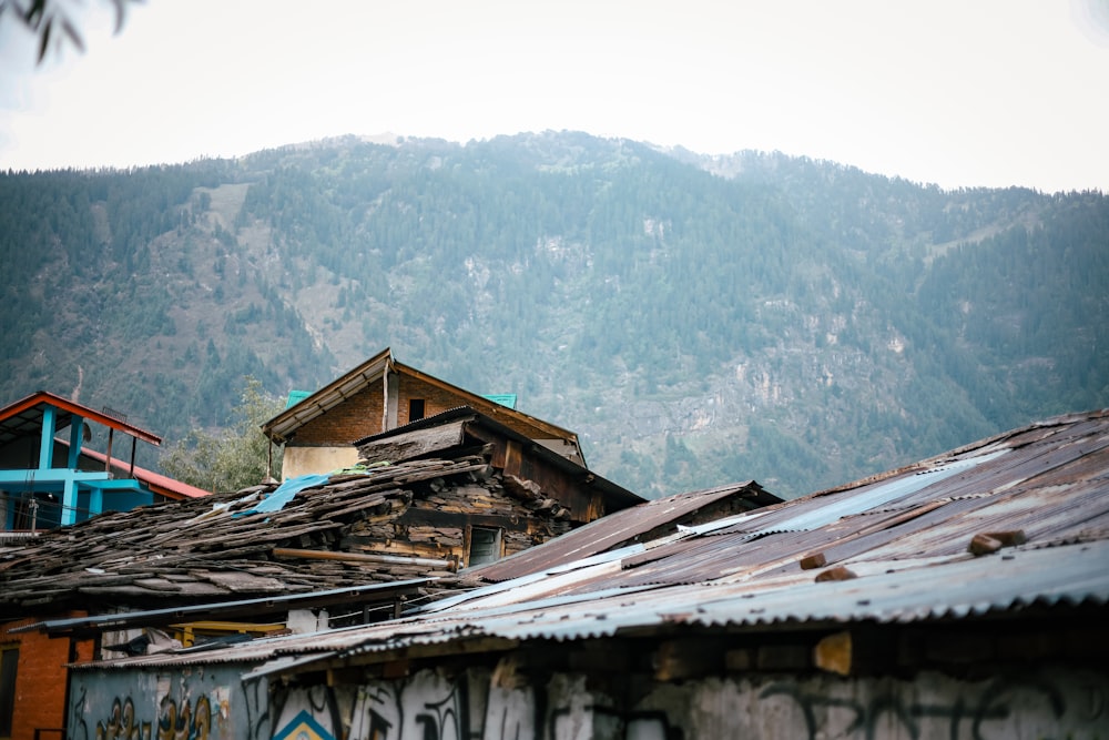 a roof of a building with mountains in the background