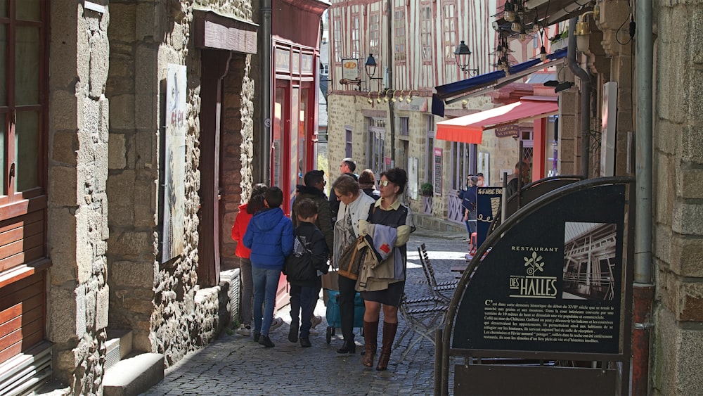 a group of people walking down a street