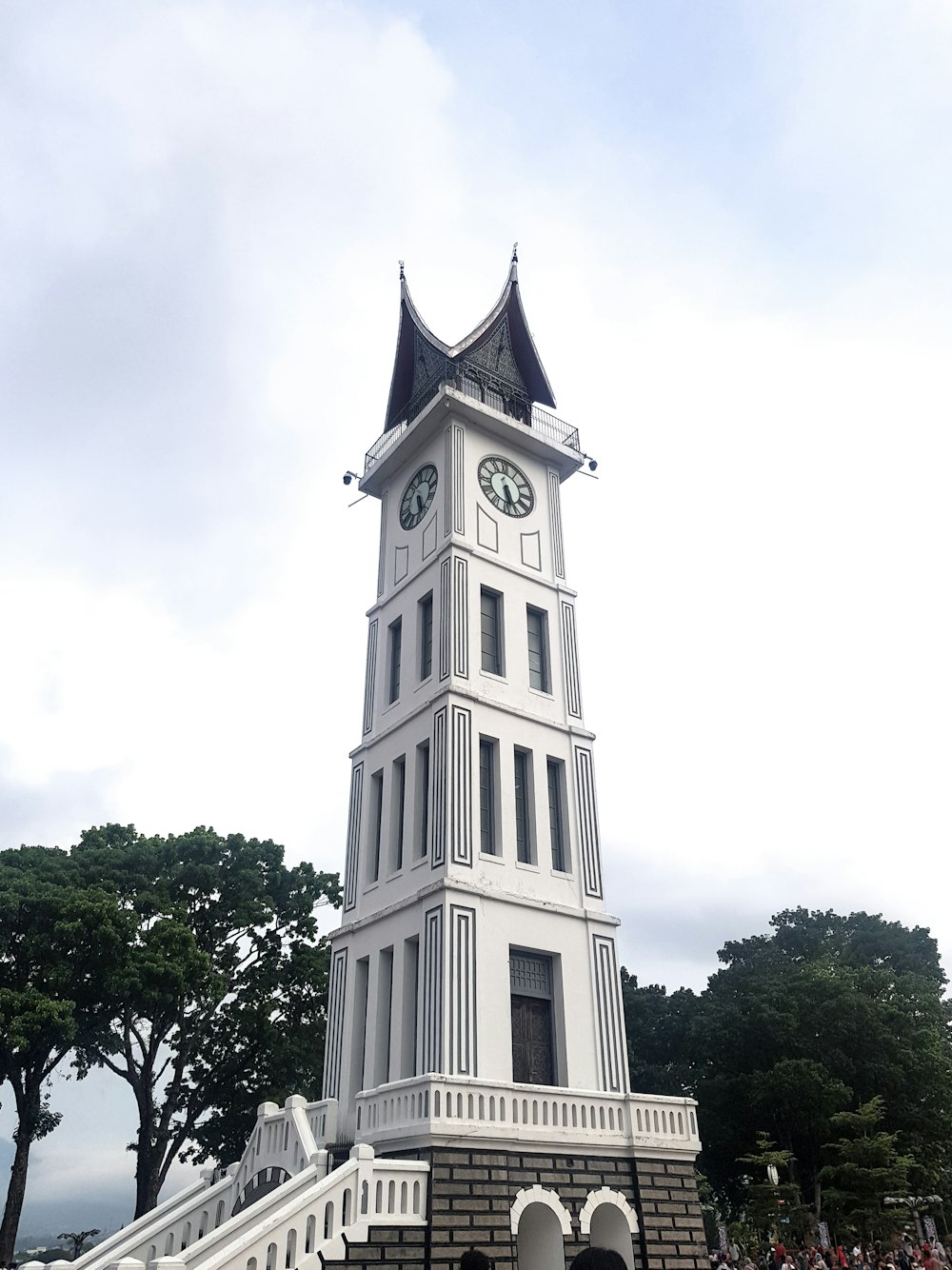a clock tower on Jam Gadang