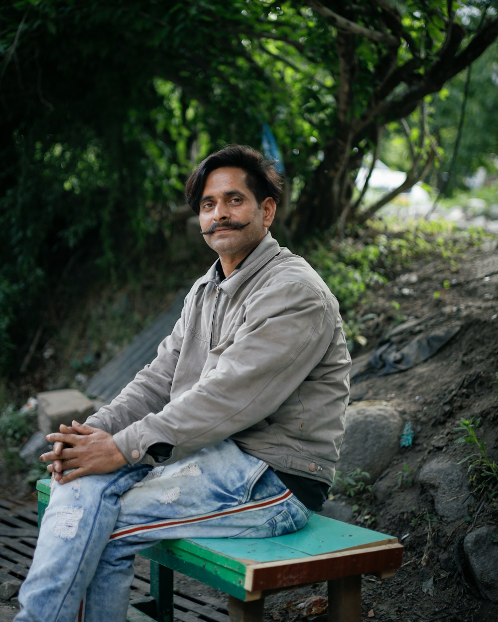 a man sitting on a bench