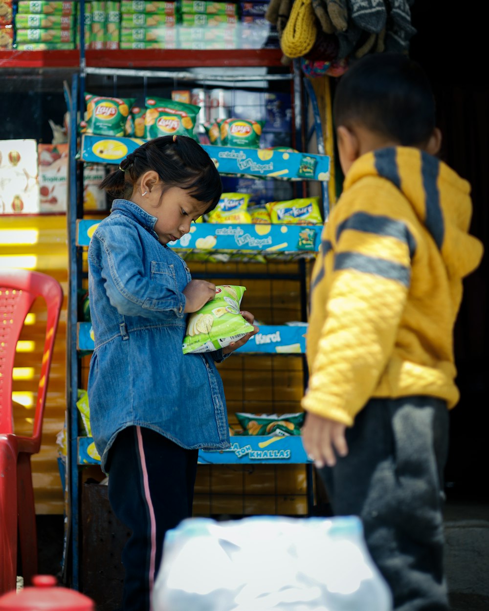 a boy and girl in a store