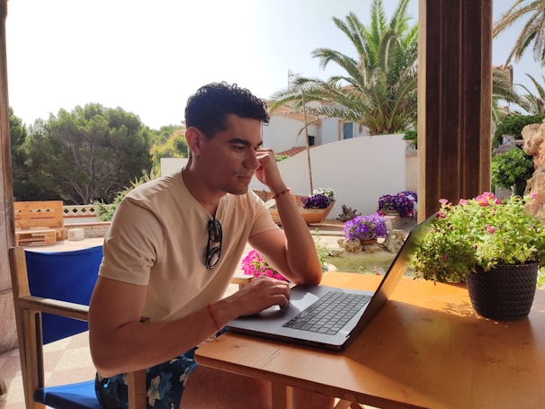 A serene outdoor setting with a person working on a laptop.