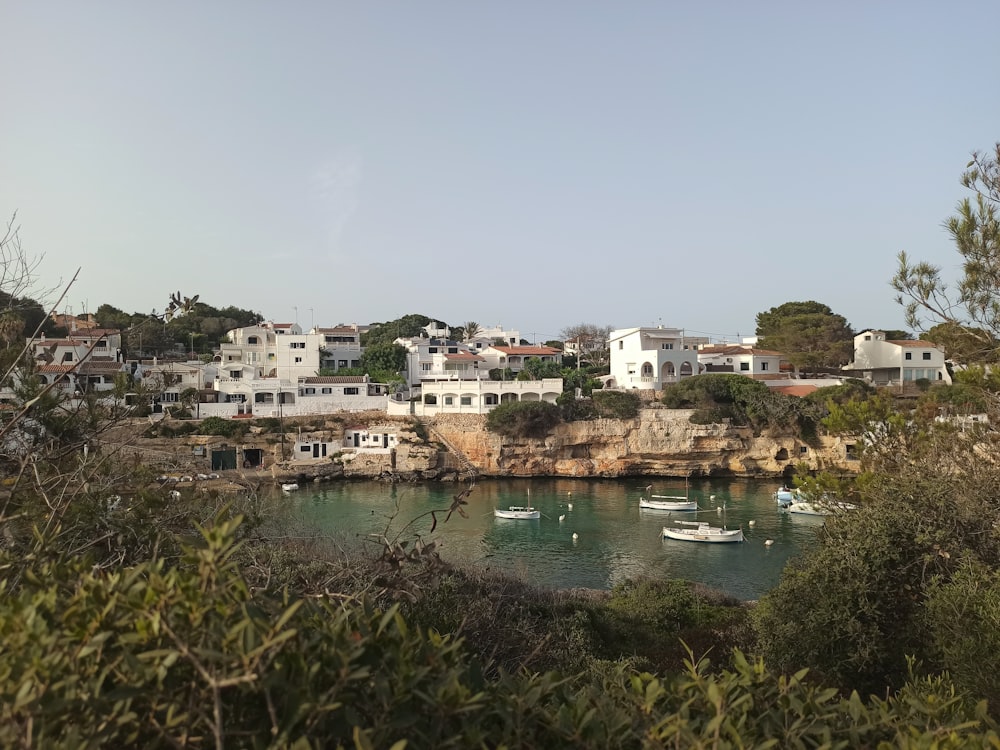 a body of water with boats in it and buildings around it