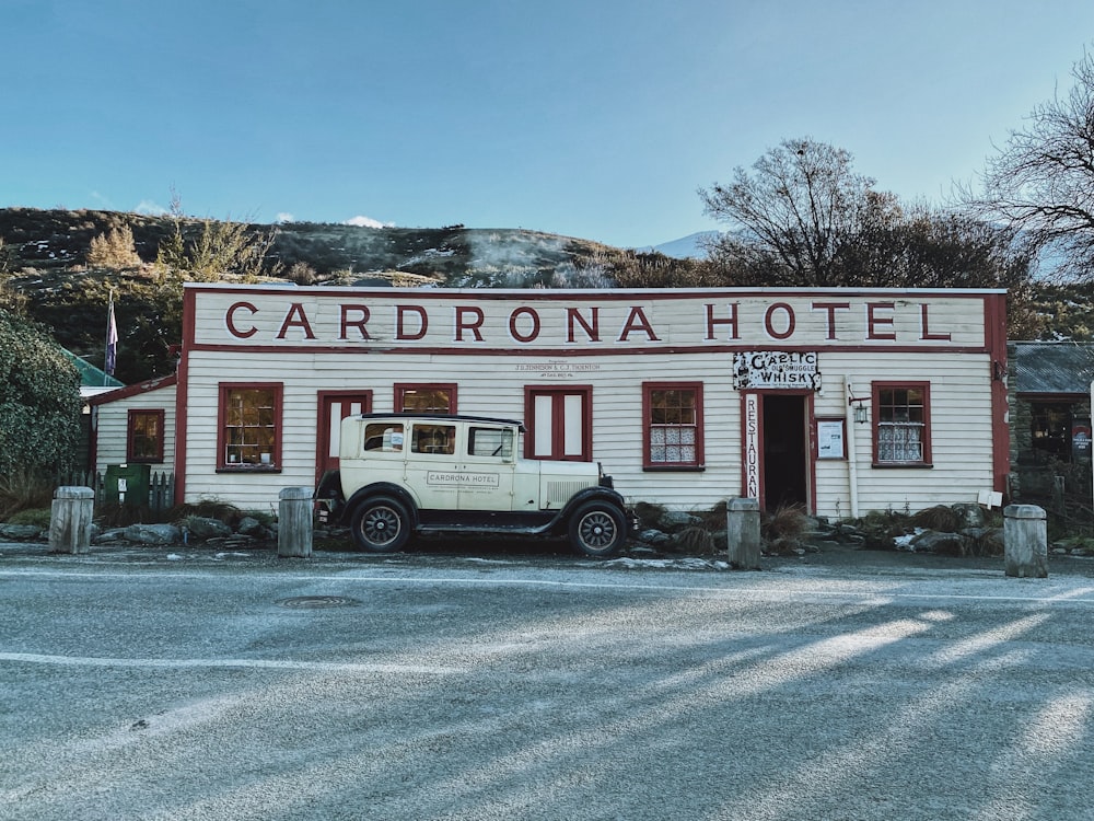 a white truck parked outside a building