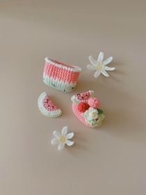 a group of cupcakes with flowers on a white surface