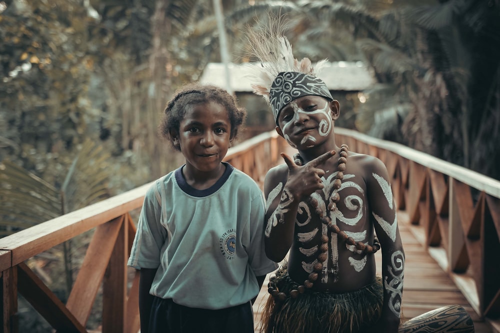 a boy and a girl posing for a picture