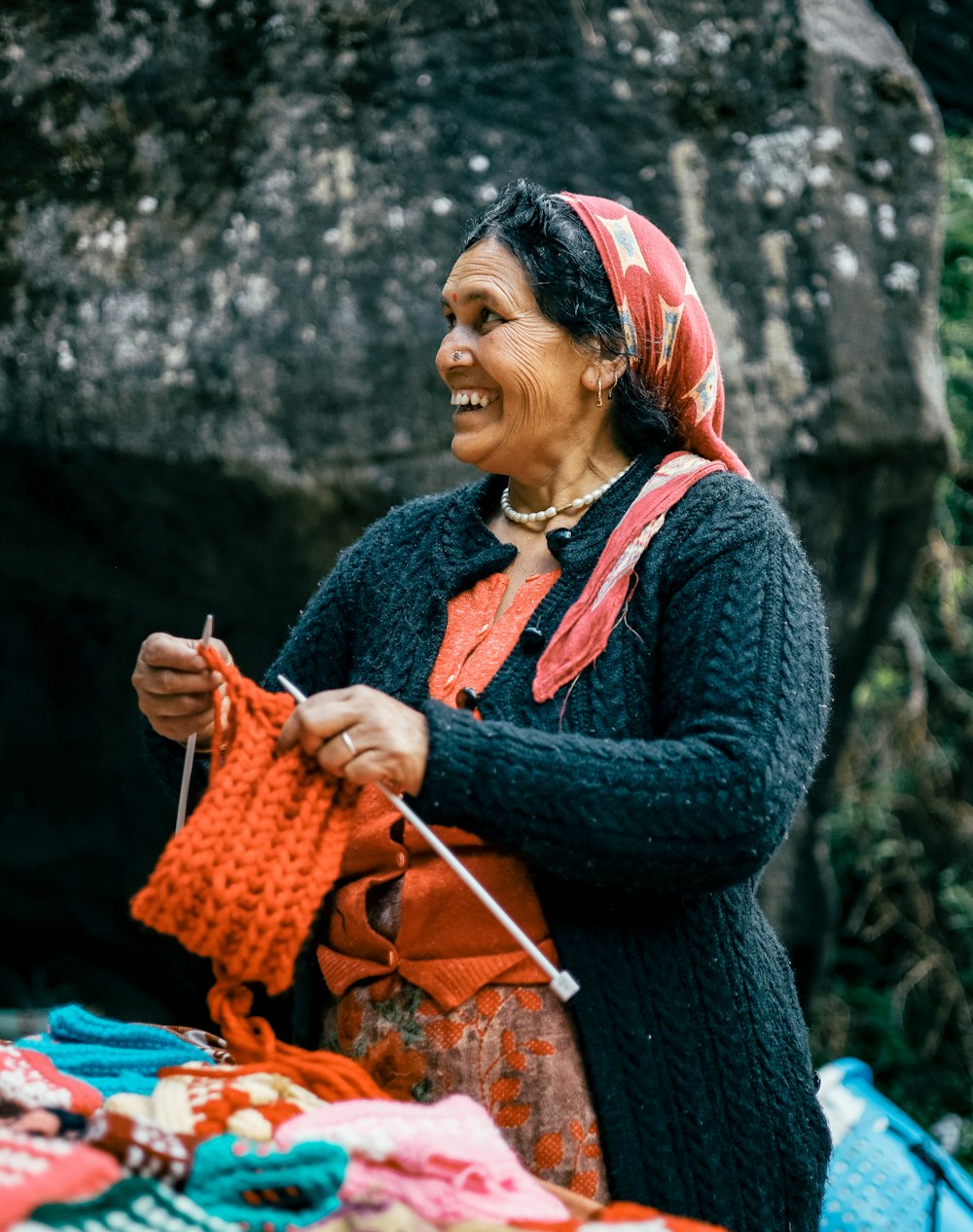 a person holding a red bag