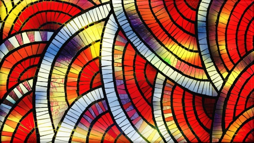 A vibrant fused glass mosaic featuring cast glass relief pieces.