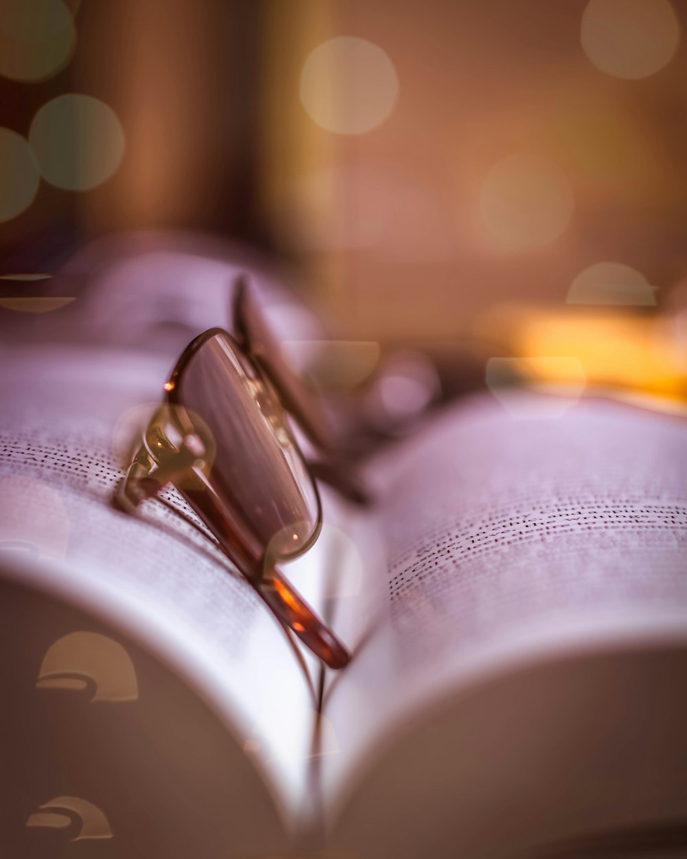 a pair of wedding rings on a bed