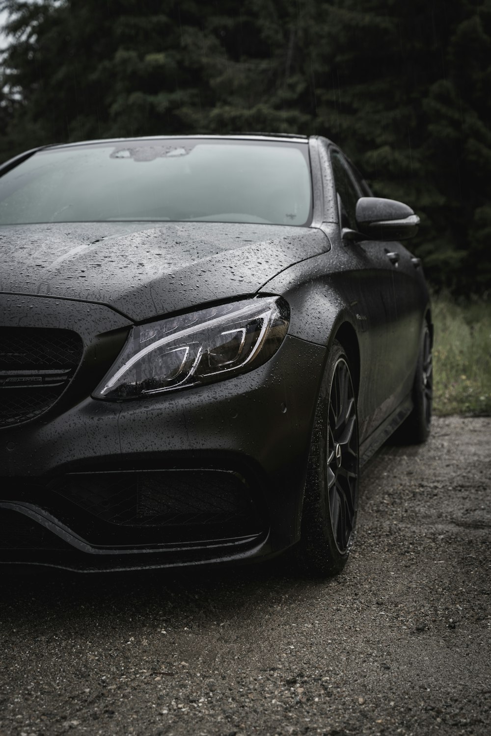 a black car parked on a road