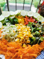 A vibrant salad drizzled with seh enhancer, highlighting fresh vegetables and a light, healthy vibe.