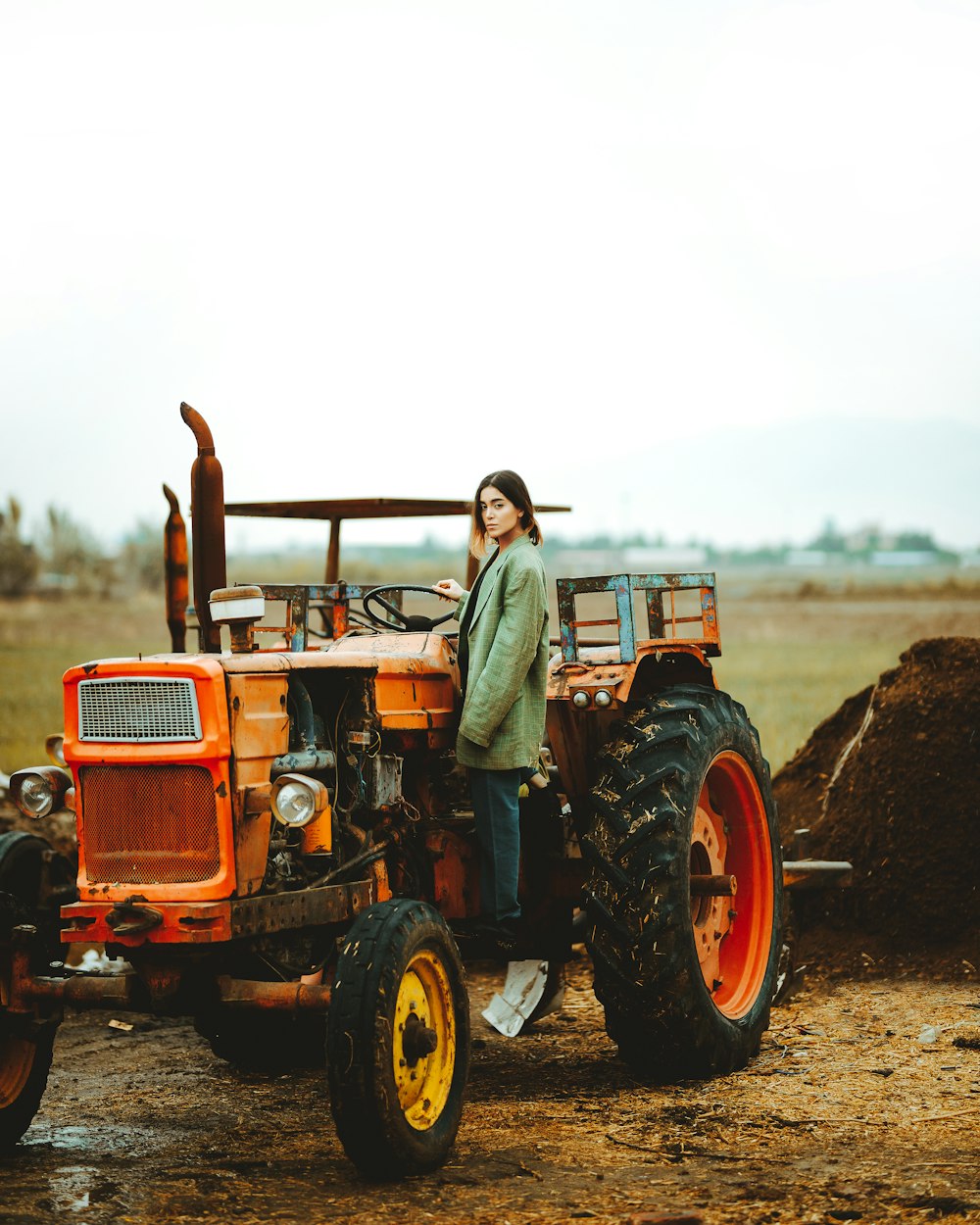 a person standing next to a tractor