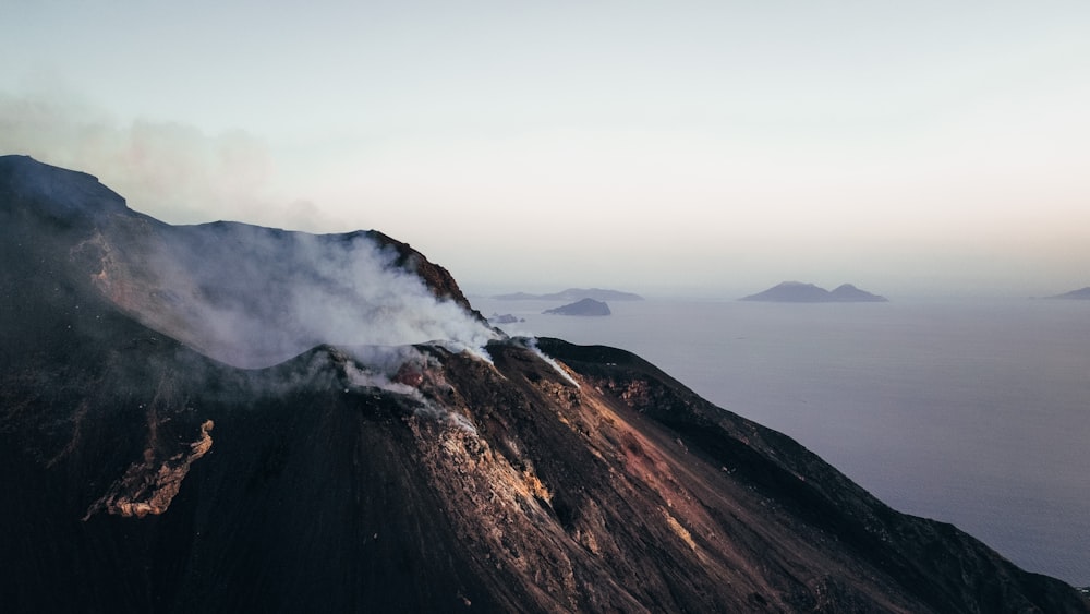 a mountain with fog around it