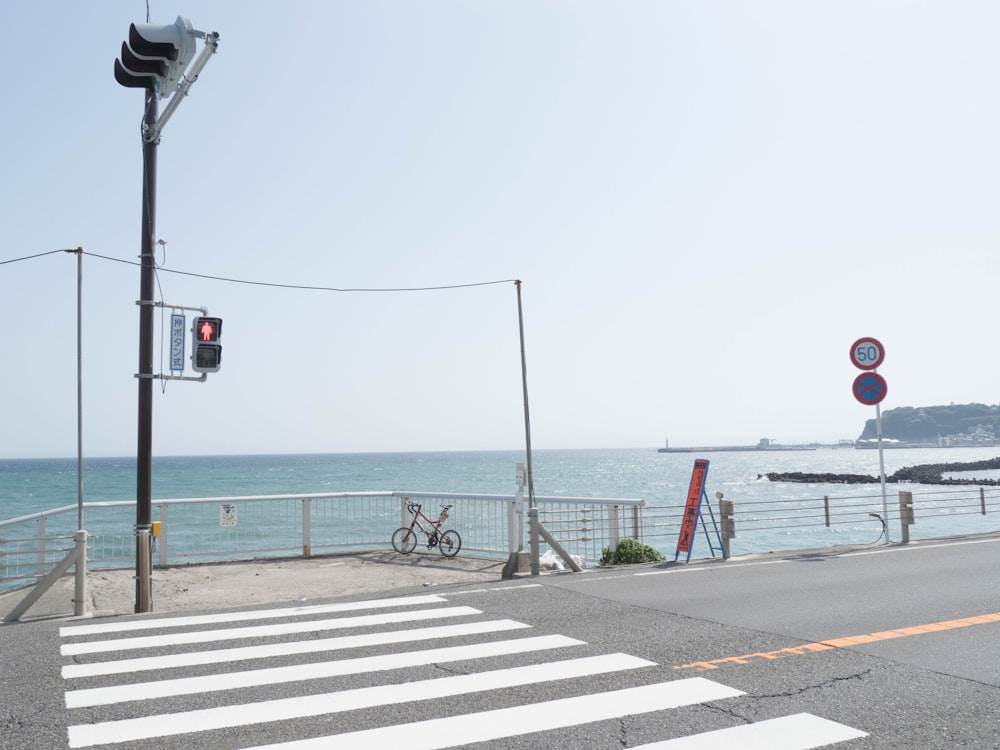 a bicycle is parked on the side of a road