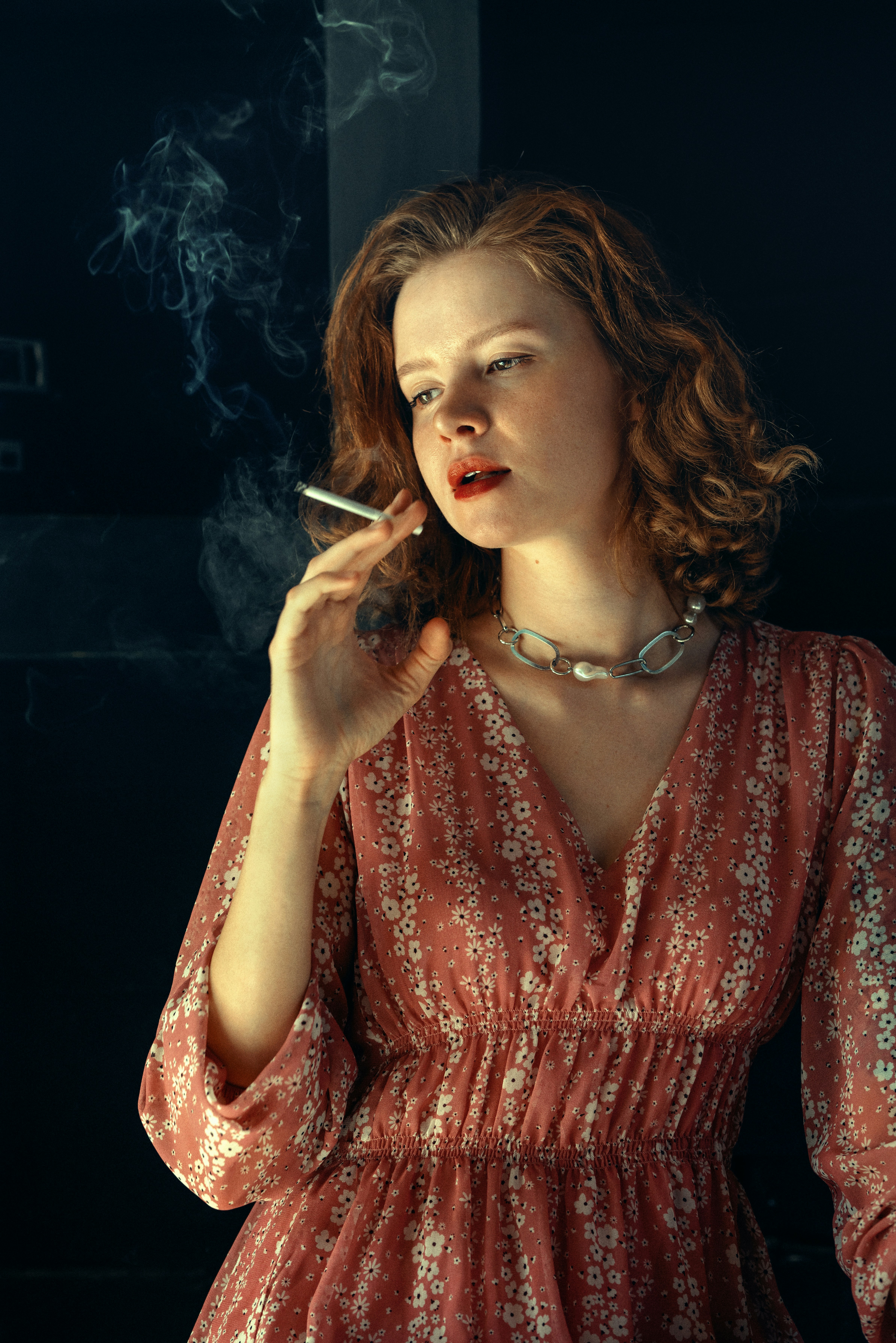A woman in a red dress smoking a cigarette photo – Free Portrait Image on  Unsplash