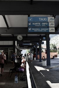 Friendly Gontijo staff assisting passengers at a bus terminal.