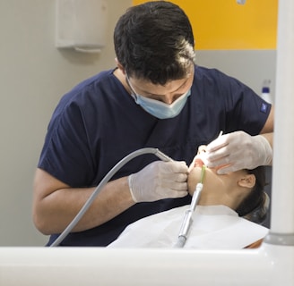 a dentist working on a patient