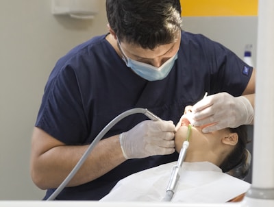 a dentist working on a patient