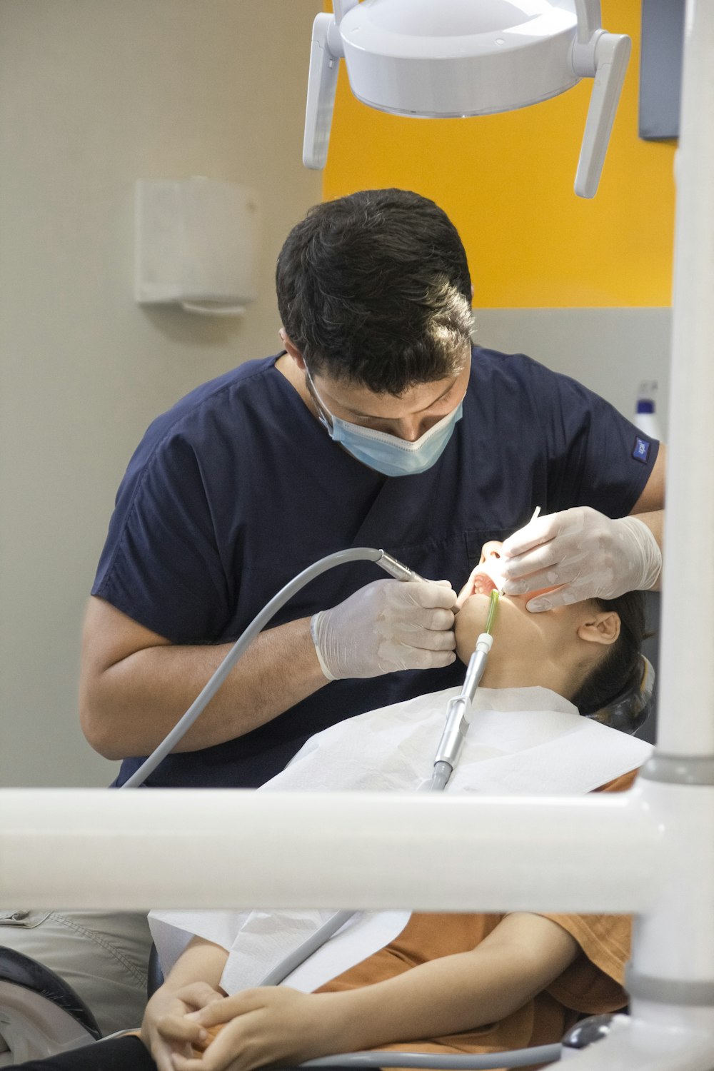 a dentist working on a patient