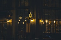 Evening lights glowing warmly from a popular neighborhood café.