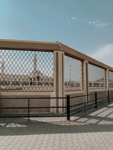a metal fence with a metal gate