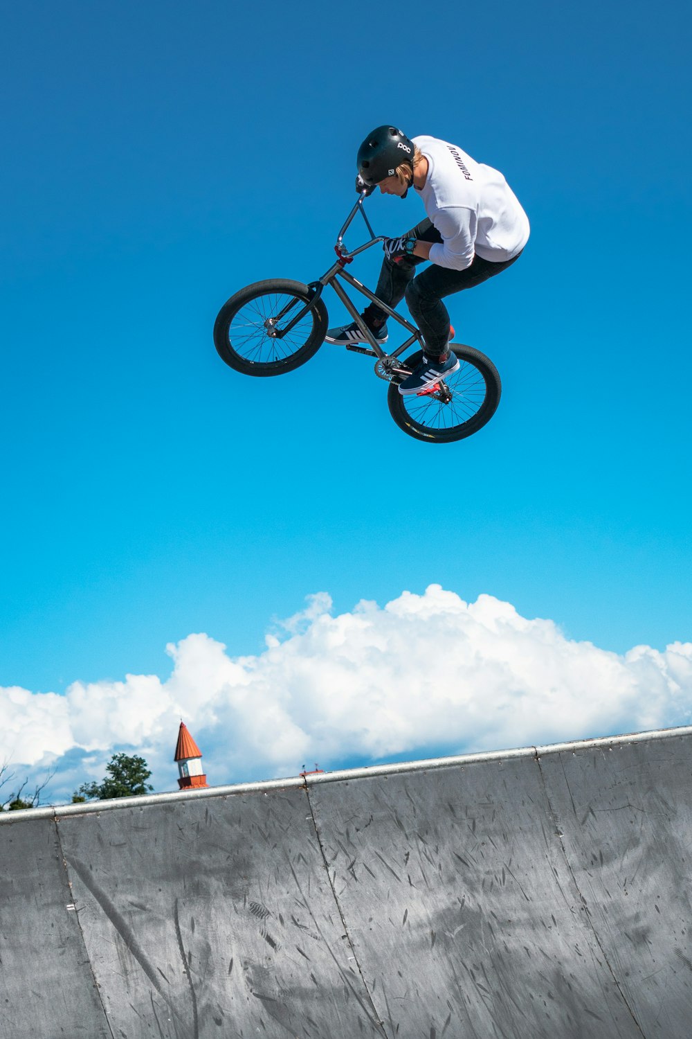 a man riding a bike on a ramp