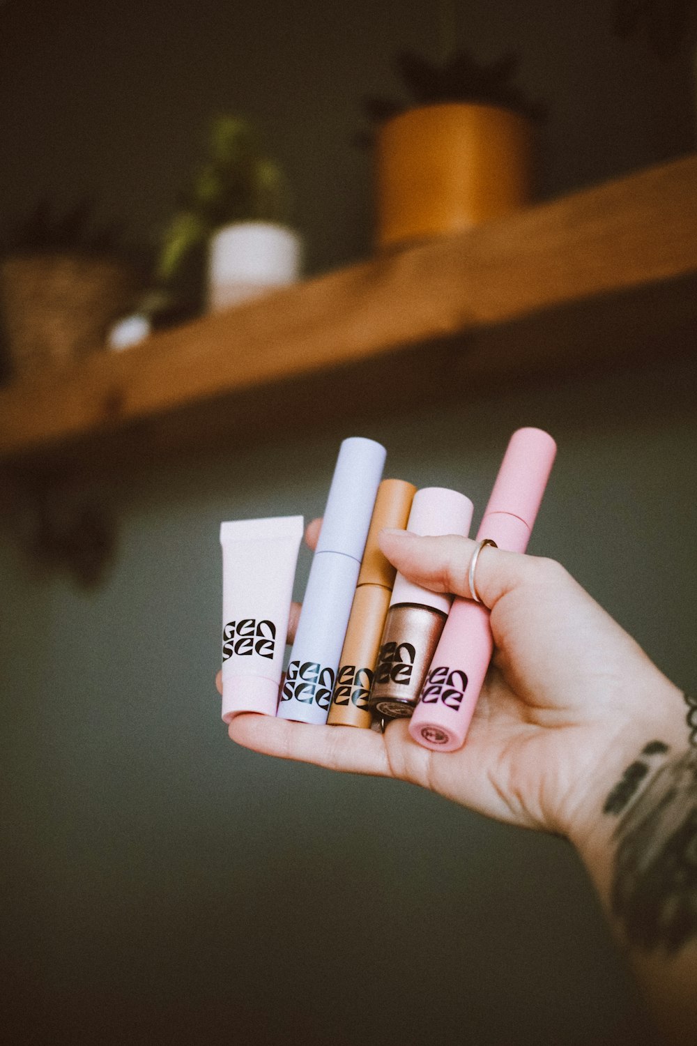 a person holding a couple of cigarettes