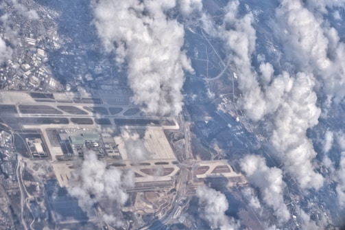 Aerial view of an airport with planes on the runway.
