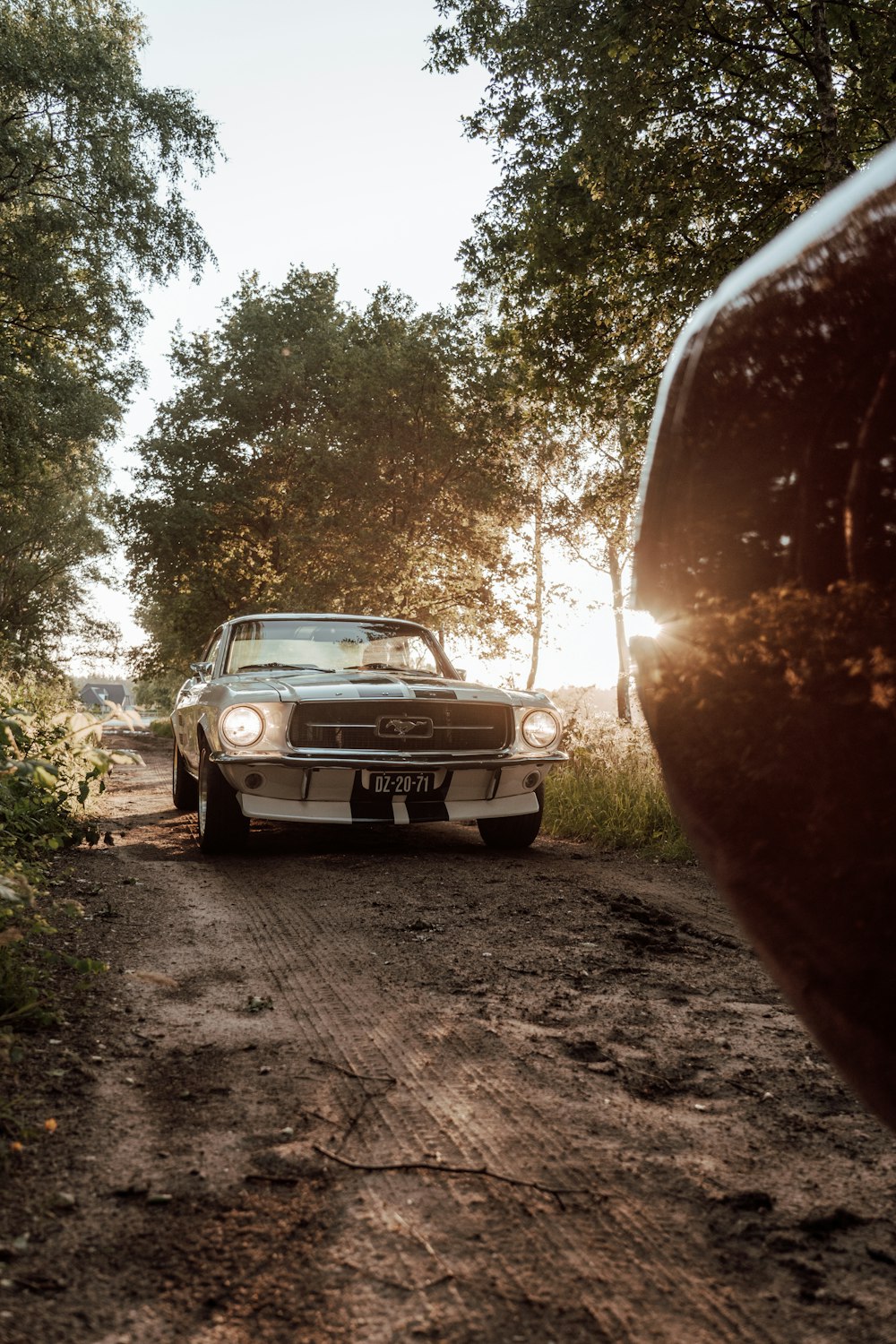 a car parked on a dirt road