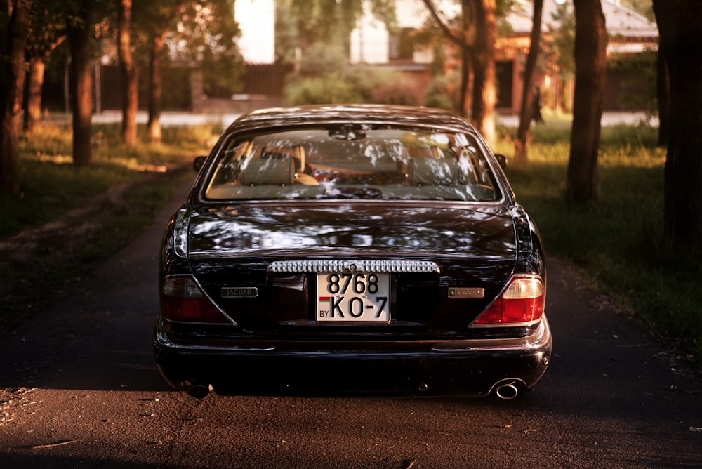 a black car parked on a road