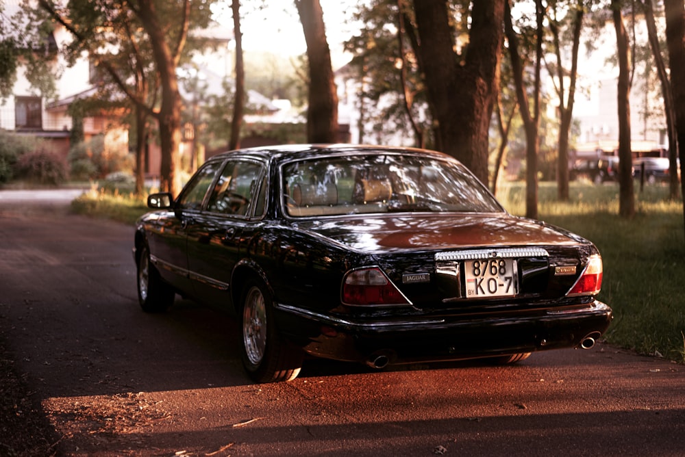 a black car parked on a road