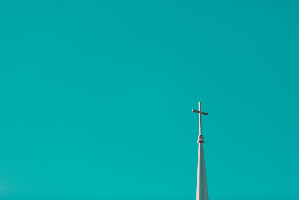 a wind turbine against a blue sky