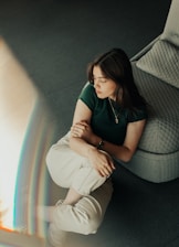 Calm woman practicing mindfulness in a bright, serene room.