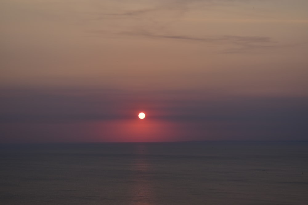 a sunset over a body of water