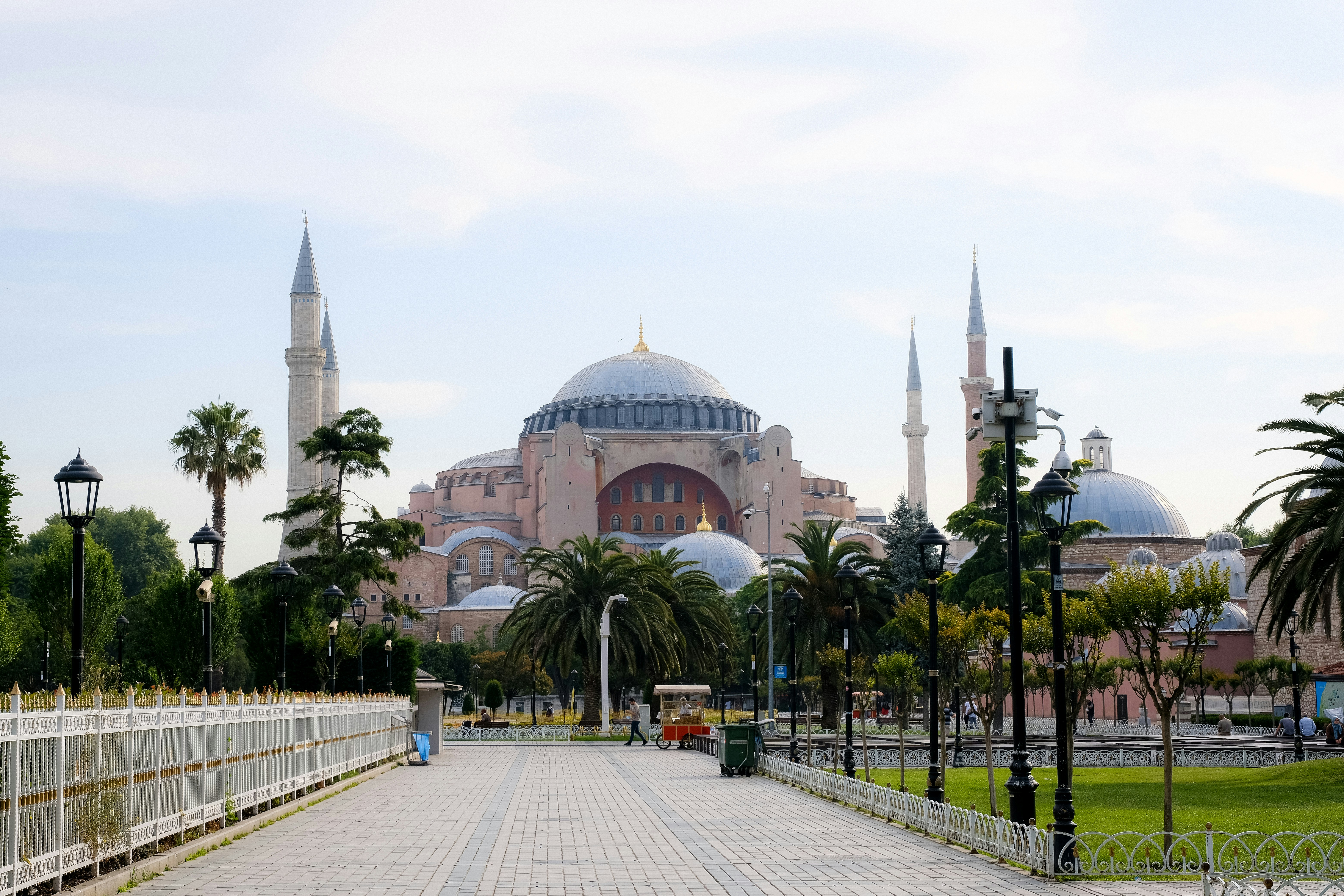 a walkway leading to a domed building