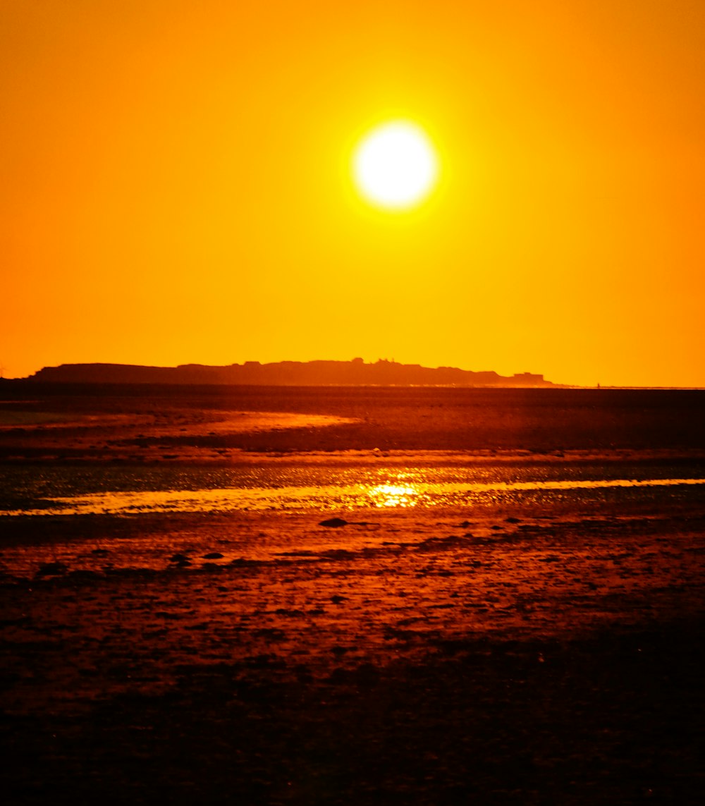 a sunset over a beach