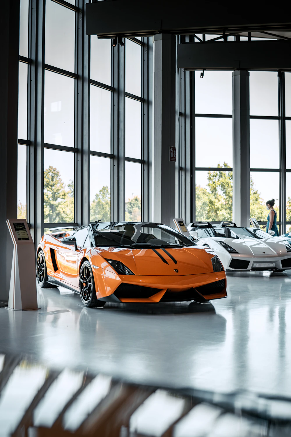 Yellow performance car displayed in a bright studio