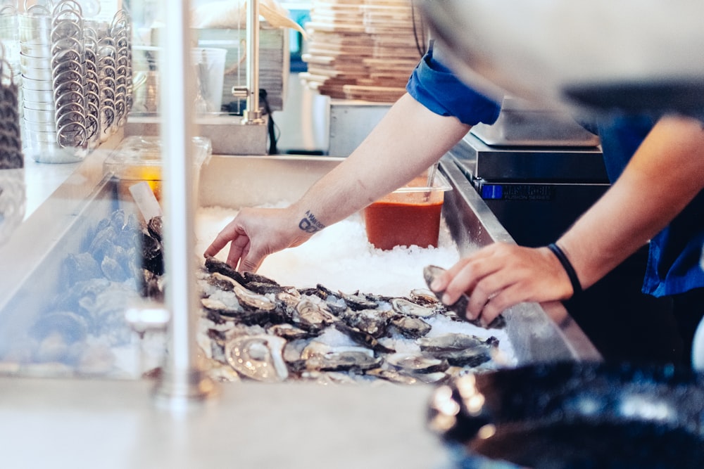 a person making oysters