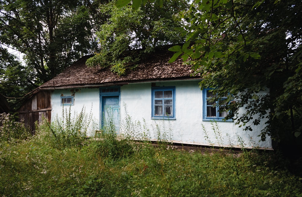 a white house with blue windows