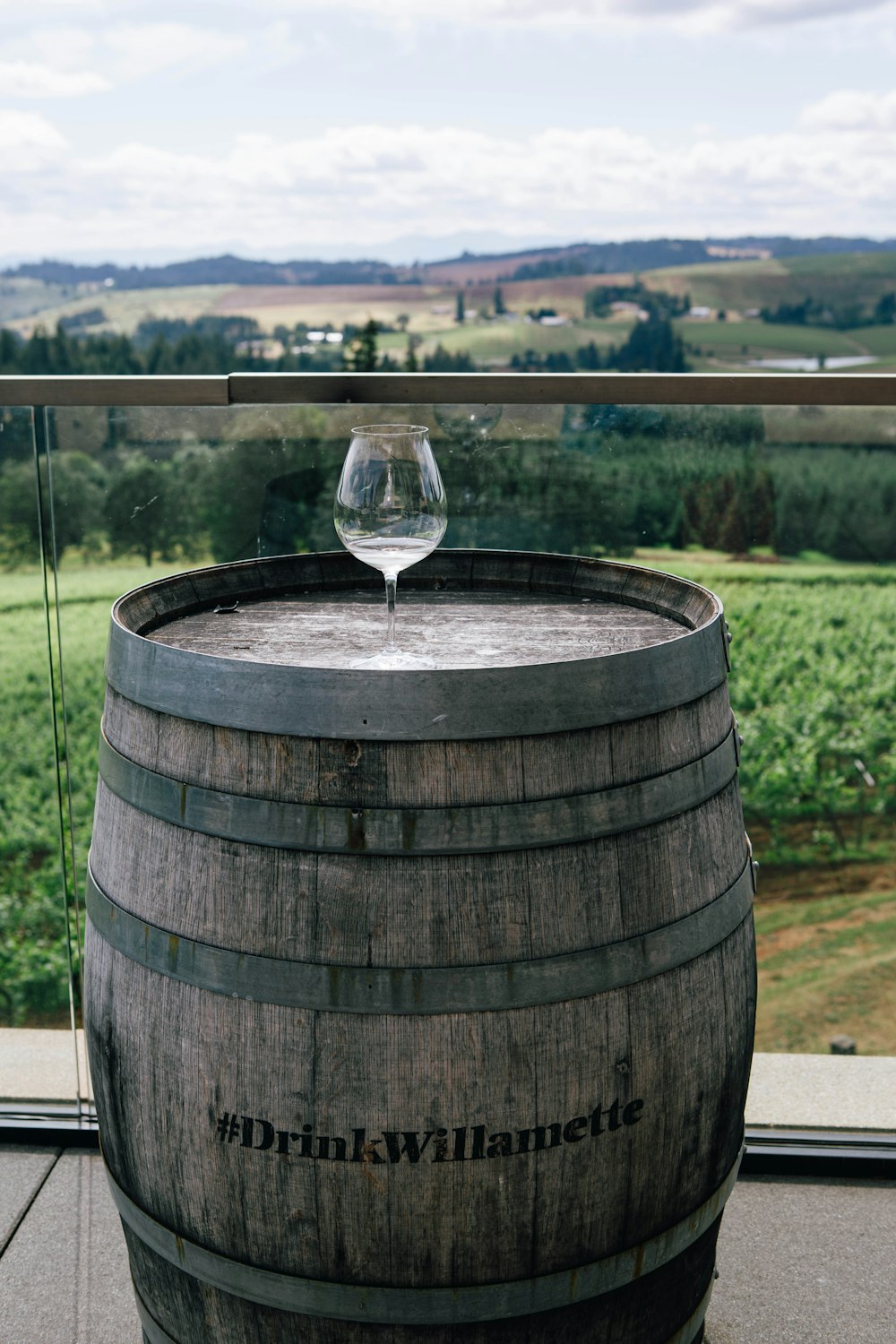 a wine glass on a barrel