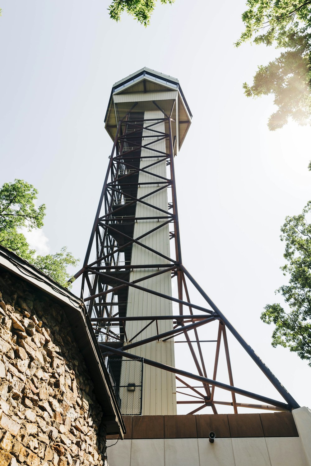 a tall tower with a metal railing