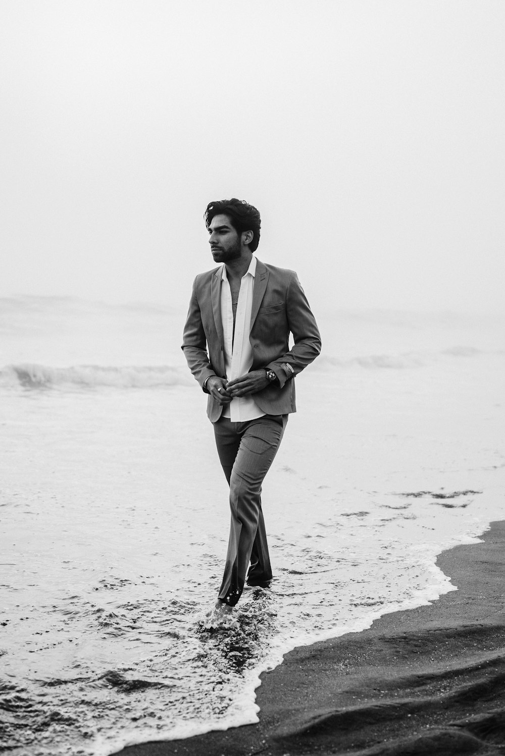 a man walking on a beach