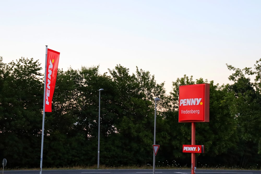 a couple of red signs on a pole